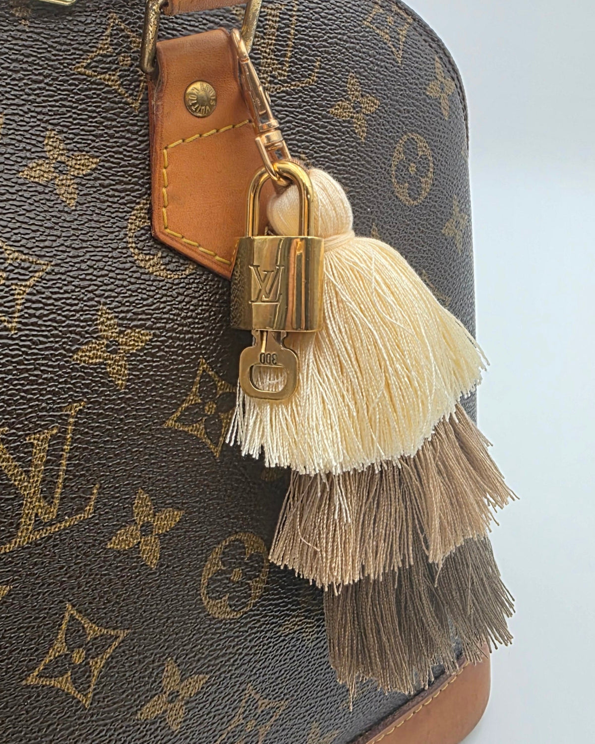 Louis Vuitton Lock and Key Tassel Charm 300- Neutral